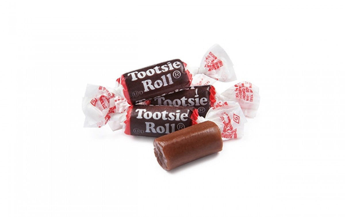 Tootsie Rolls - small inch side tootsie roll pieces with one unwrapped to show dark brown candy 