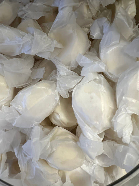 Vanilla Salt Water Taffy - White candy piece wrapped in wax paper 