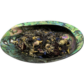 Dried Witches Garden Tea in an abalone shell.