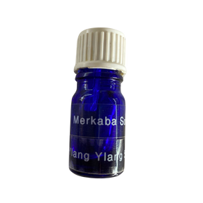 Ylang Ylang Essential Oil - Ylang Ylang Essential Oil in a small blue colored bottle with transparent label and black screw cap.