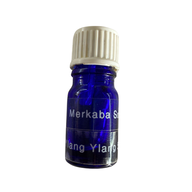 Ylang Ylang Essential Oil - Ylang Ylang Essential Oil in a small blue colored bottle with transparent label and black screw cap.