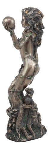 Bronze statue of a figure holding a sphere on a white background