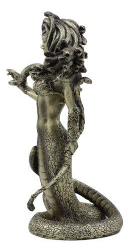 Statue of a mermaid with a snake-like tail on a white background
