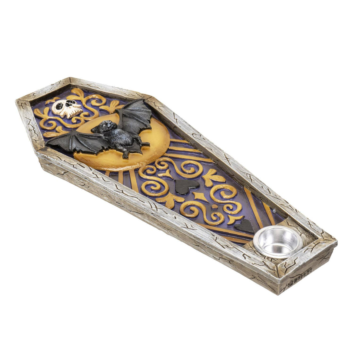 A coffin-shaped Halloween decorative tray with a small silver bowl, featuring a black bat on a gold crescent moon, a skull, and purple scrollwork on a white distressed wood-textured base.