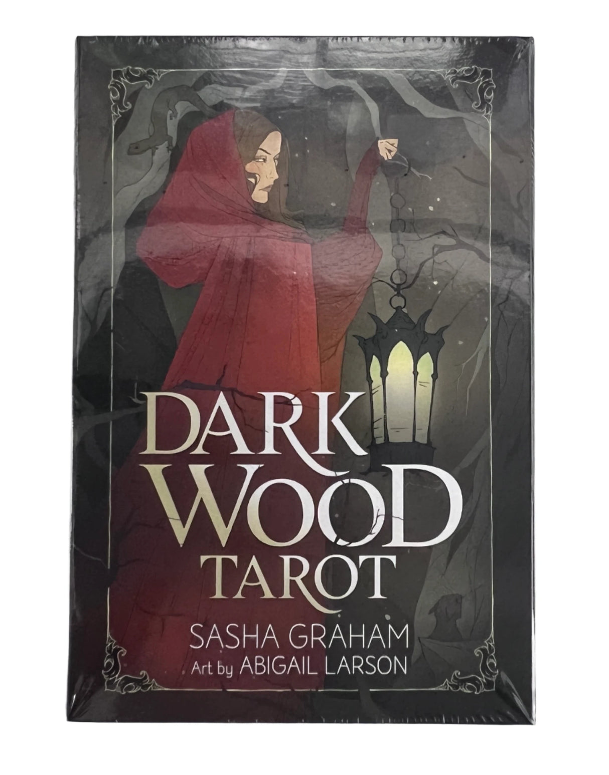 dark wood tarot with black box with image of woman in red cloak 