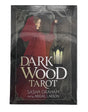 dark wood tarot with black box with image of woman in red cloak 