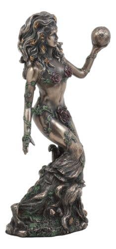 Bronze statue of a woman with flowing hair and a fruit, set against a neutral background.