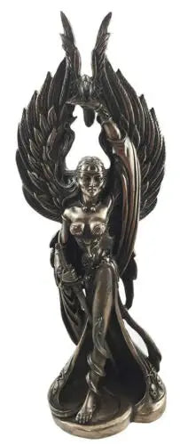 Statue of a winged figure with detailed wings and body on a white background