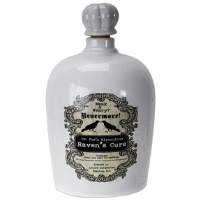 A white ceramic bottle with a gray ribbed stopper and a vintage-style black label reading 'Weak & Wary? Nevermore! Dr. Fun's Miraculous Raven's Cure'.