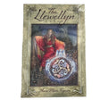 Llewellyn tarot with grey green cover and image of woman sitting 