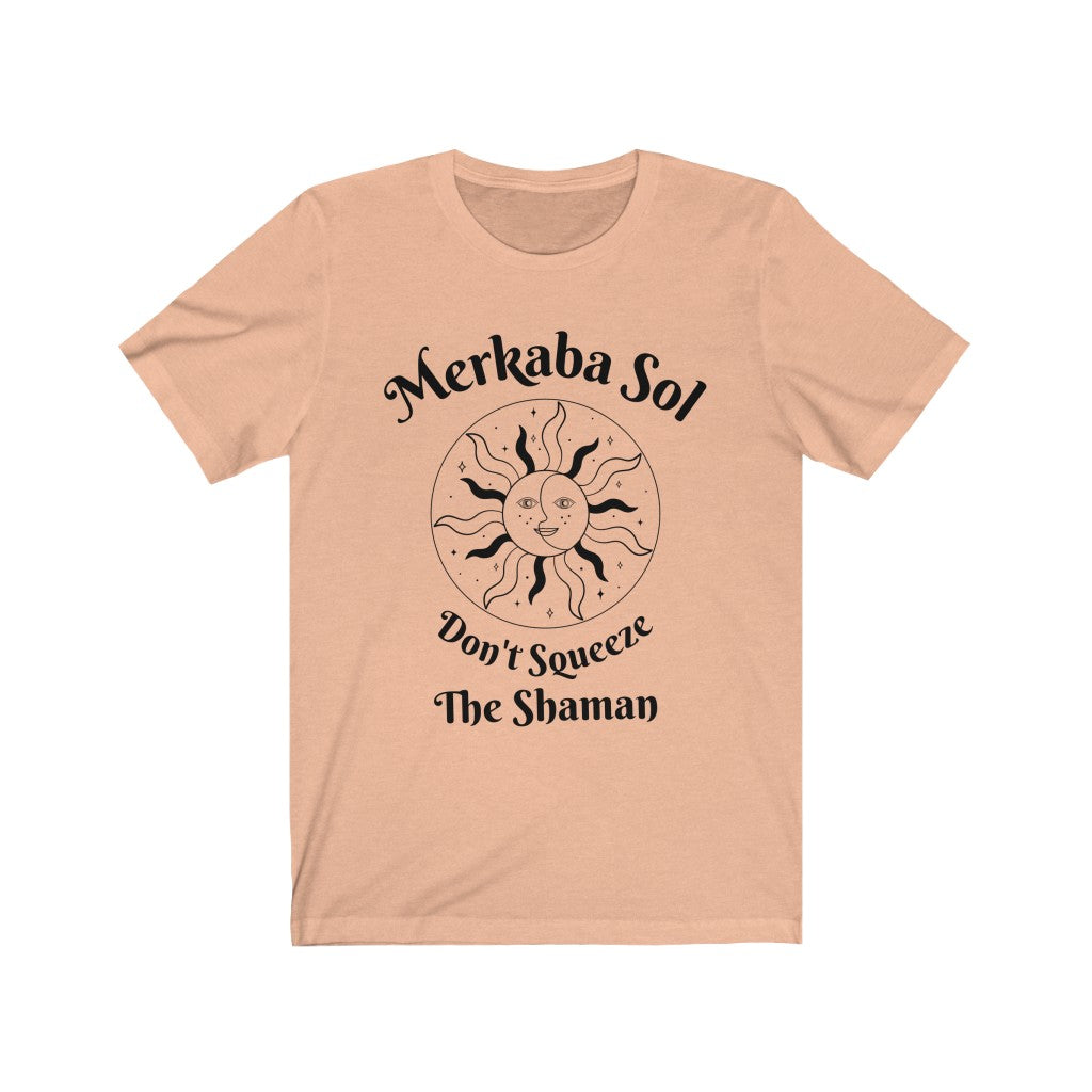 Don't squeeze the shaman. Bring inspiration and empowerment to your wardrobe with this Don't Squeeze the Shaman t-shirt in peach color or give it as a fun gift. From merkabasolshop.com