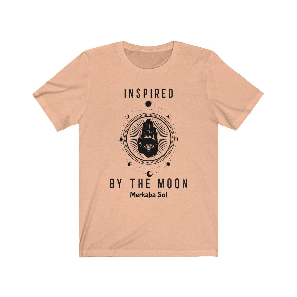 Inspired By The Moon. Bring inspiration and empowerment to your wardrobe with this Inspired By The Moon t-shirt in peach color or give it as a fun gift. From merkabasolshop.com