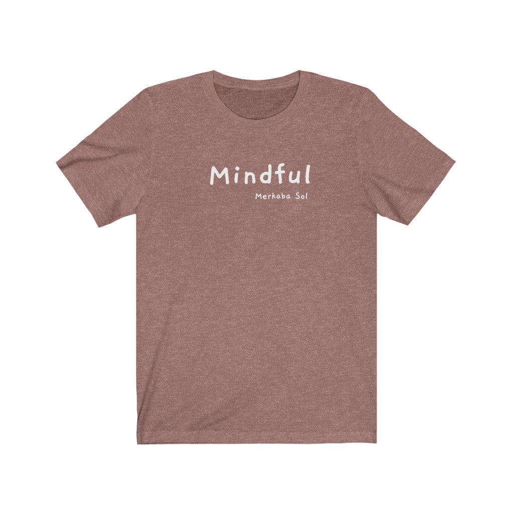 A mindful message for all to see.  Bring a unique shirt to your wardrobe with this Mindful t-shirt in this heather mauve color or give it as a fun gift. From merkabasolshop.com
