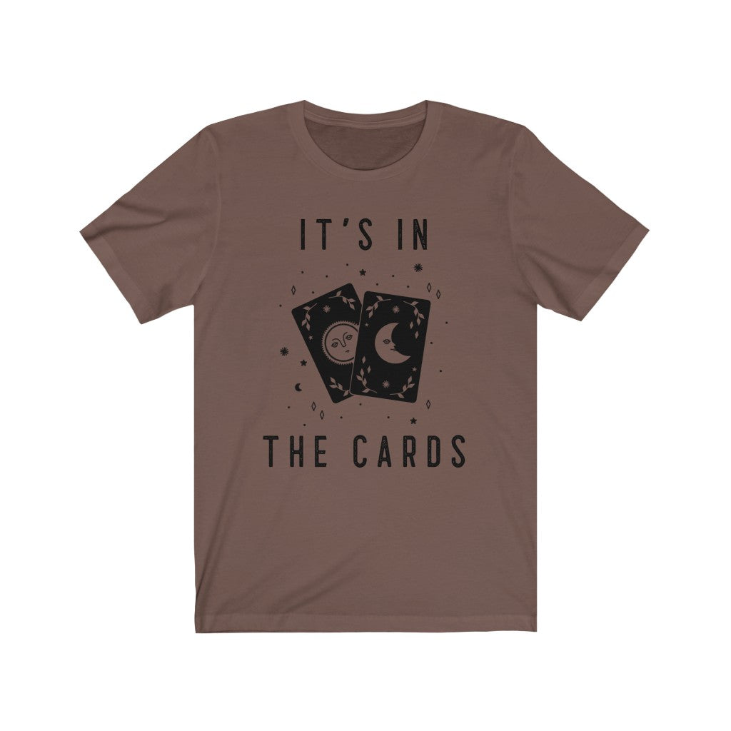 It's In The Cards. Bring inspiration and empowerment to your wardrobe with this It's In The Cards t-shirt in brown color or give it as a fun gift. From merkabasolshop.com