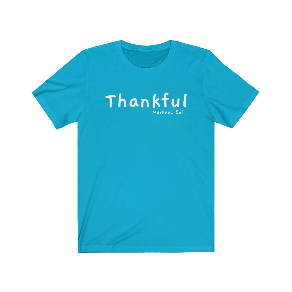 Embrace being thankful. Bring inspiration and empowerment to your wardrobe with this Thankful t-shirt in turquoise color or give it as a fun gift. From merkabasolshop.com