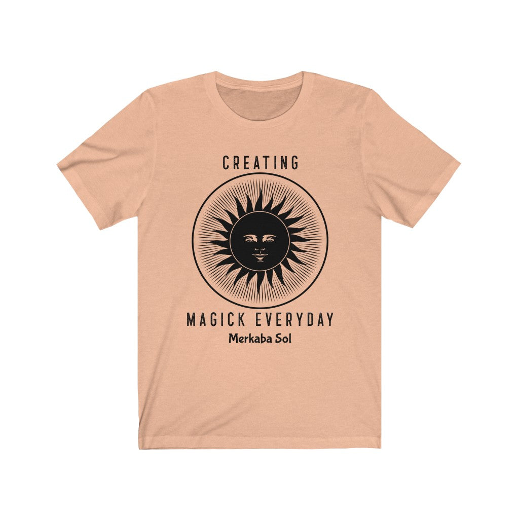 Creating Magick Everyday. Bring inspiration and empowerment to your wardrobe with this Creating Magick Everyday t-shirt in peach color or give it as a fun gift. From merkabasolshop.com