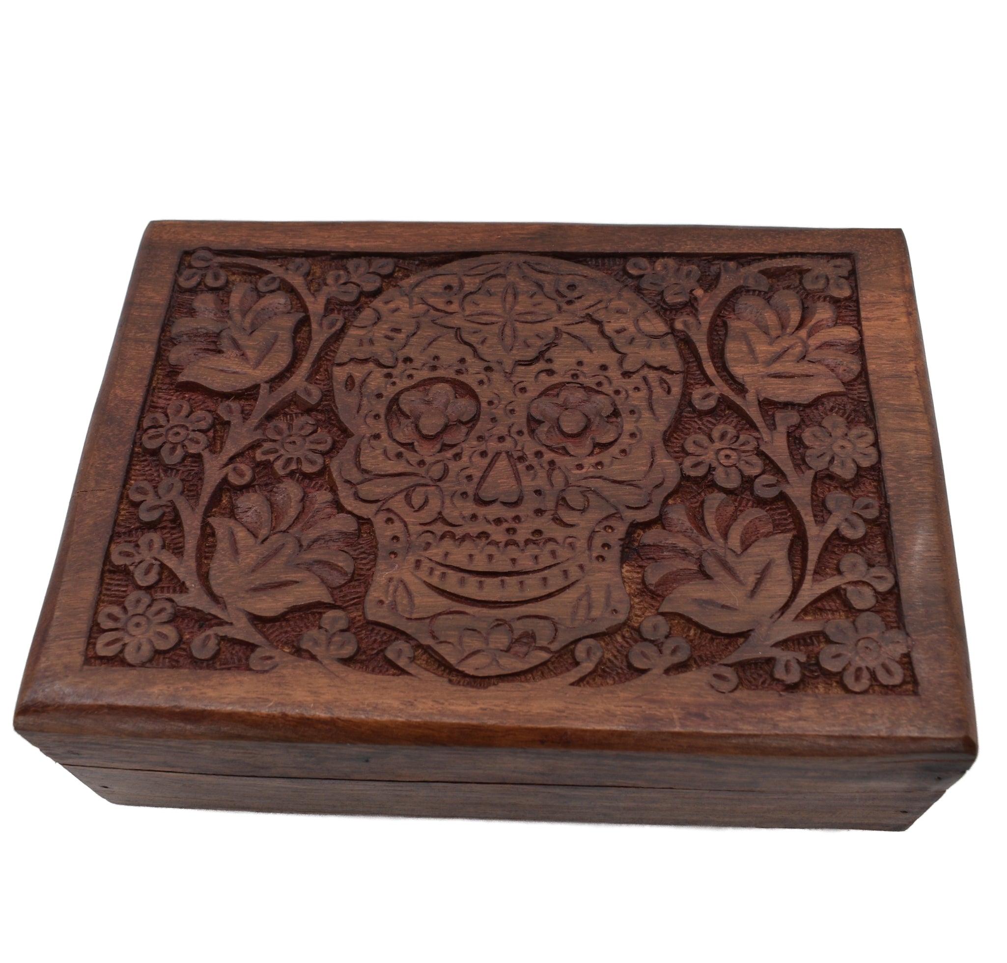 dark wood box carved flowers and skull in middle 