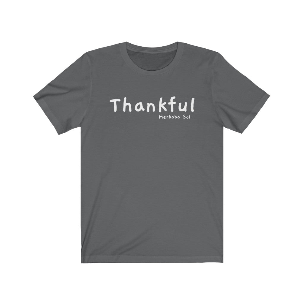 Embrace being thankful. Bring inspiration and empowerment to your wardrobe with this Thankful t-shirt in asphalt color or give it as a fun gift. From merkabasolshop.com