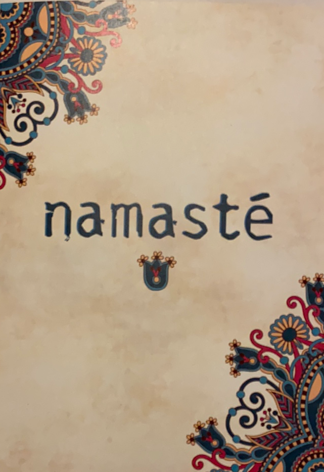 Beige with the word Namaste on front 