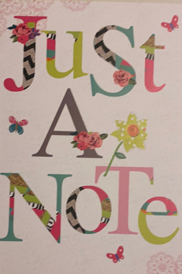 White card with &quot;just a Note&quot; written in colors 