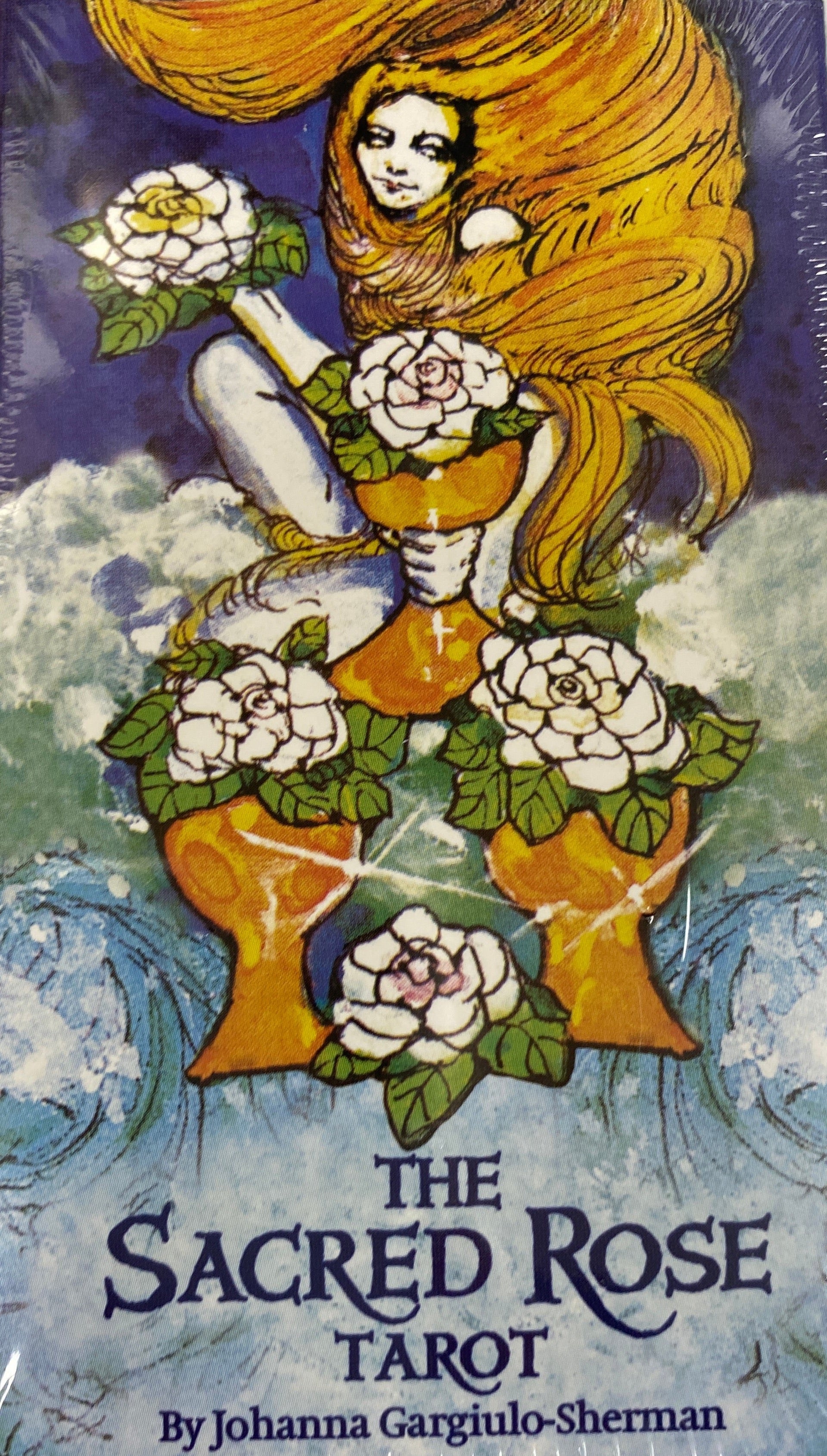Blue colored deckmplckage with image of woman with long hair holding cup with flowers 
