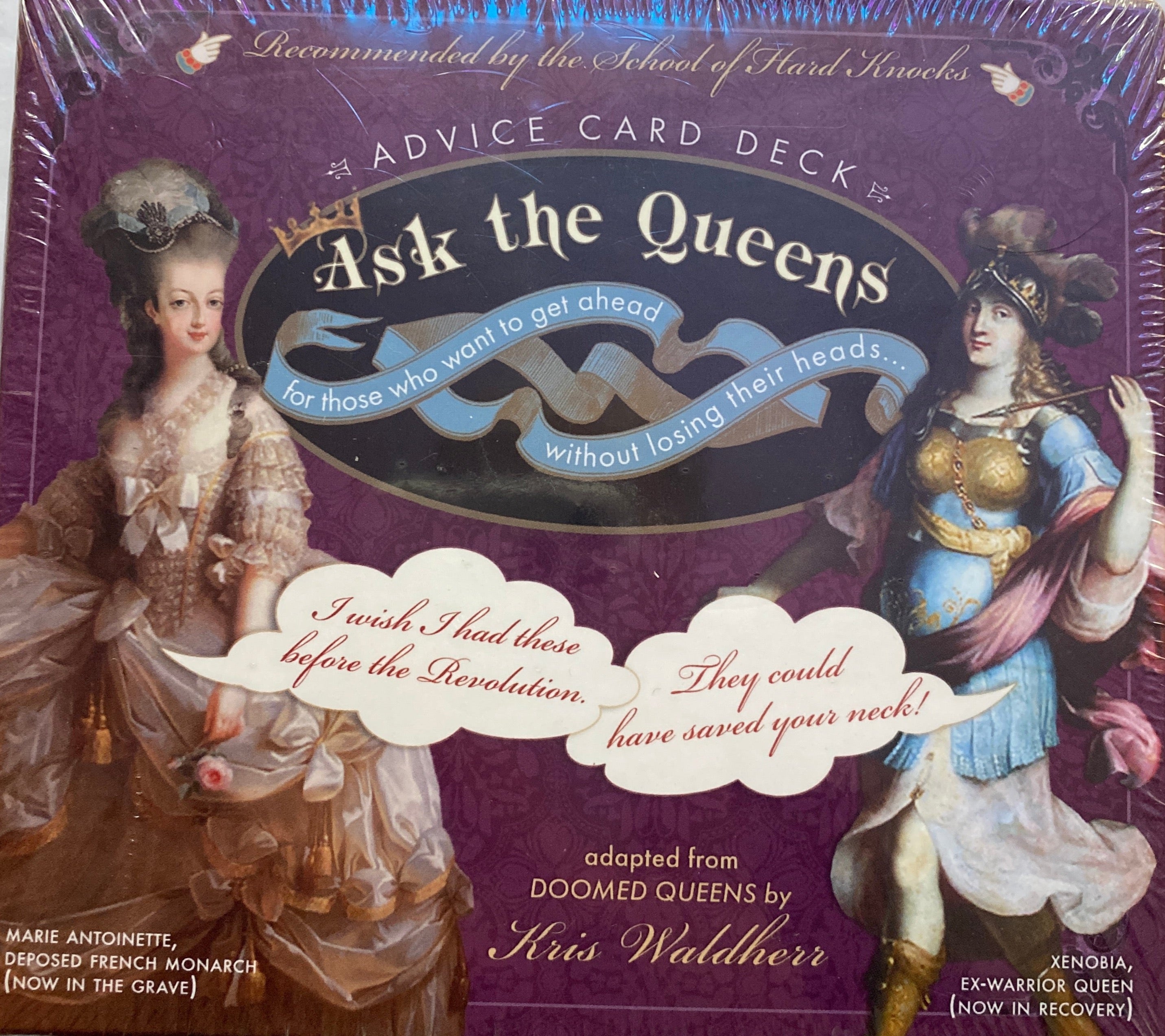 Rectangle plumb colored box with picture of two woman dressed in royal robes 