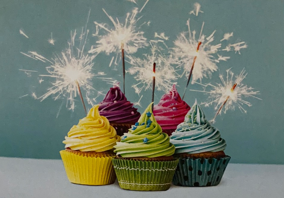 Colorful card with cupcakes and sparklers 