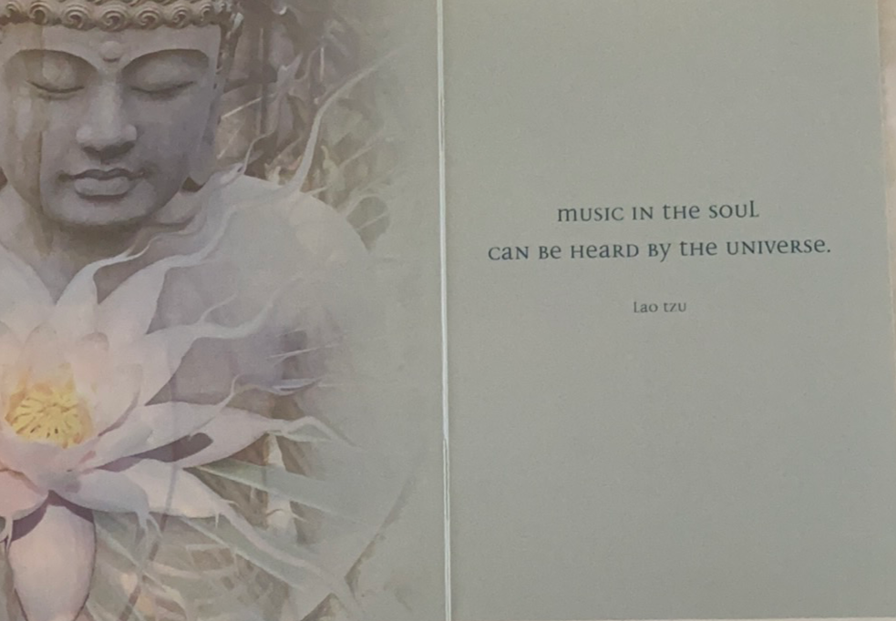 Inside left has buddha and lotus with quote on the right 